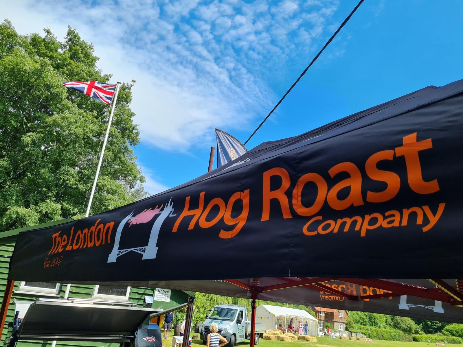 The London Hog Roast Company gazebo under a blue sky with a Union flag