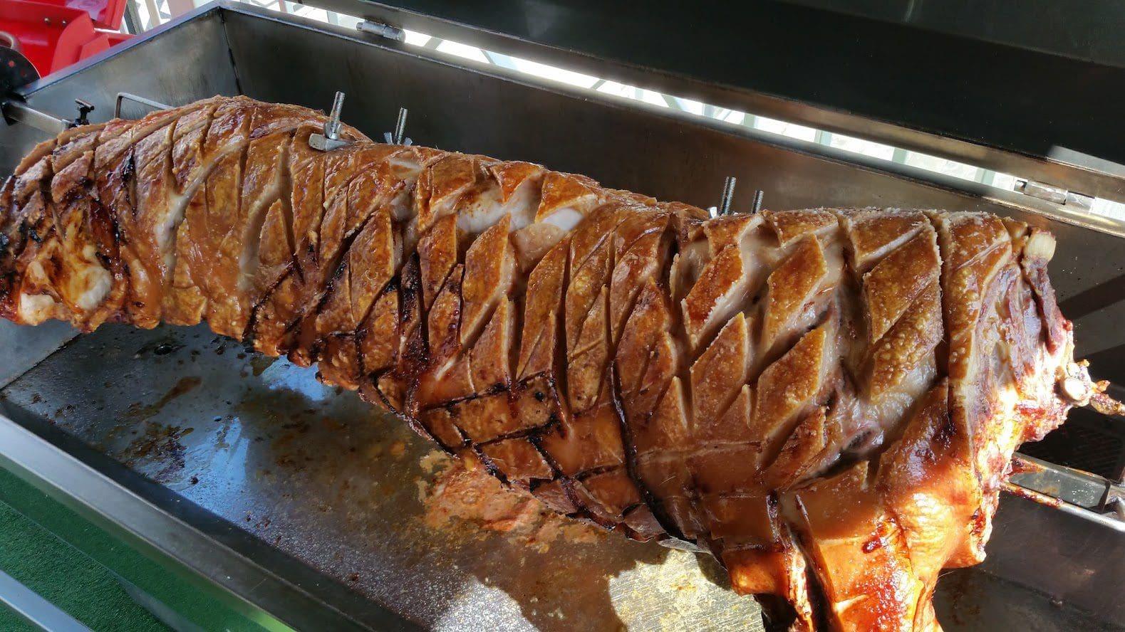Whole hog roasting in a stainless steel machine
