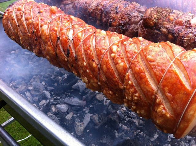 Pork loin crackling over glowing charcoal