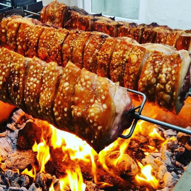 Pork loins over open flames