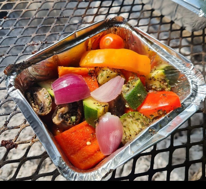 Vegetable pot with rice and spices in a foil tray