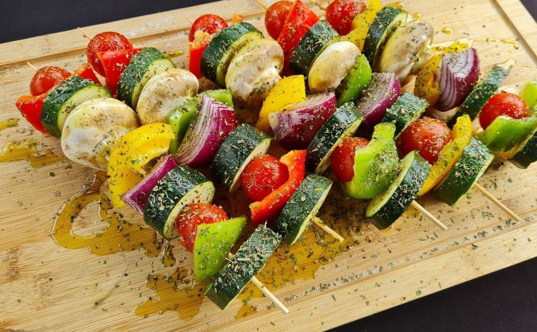 Vegetable skewers with courgette, onion, tomato and peppers