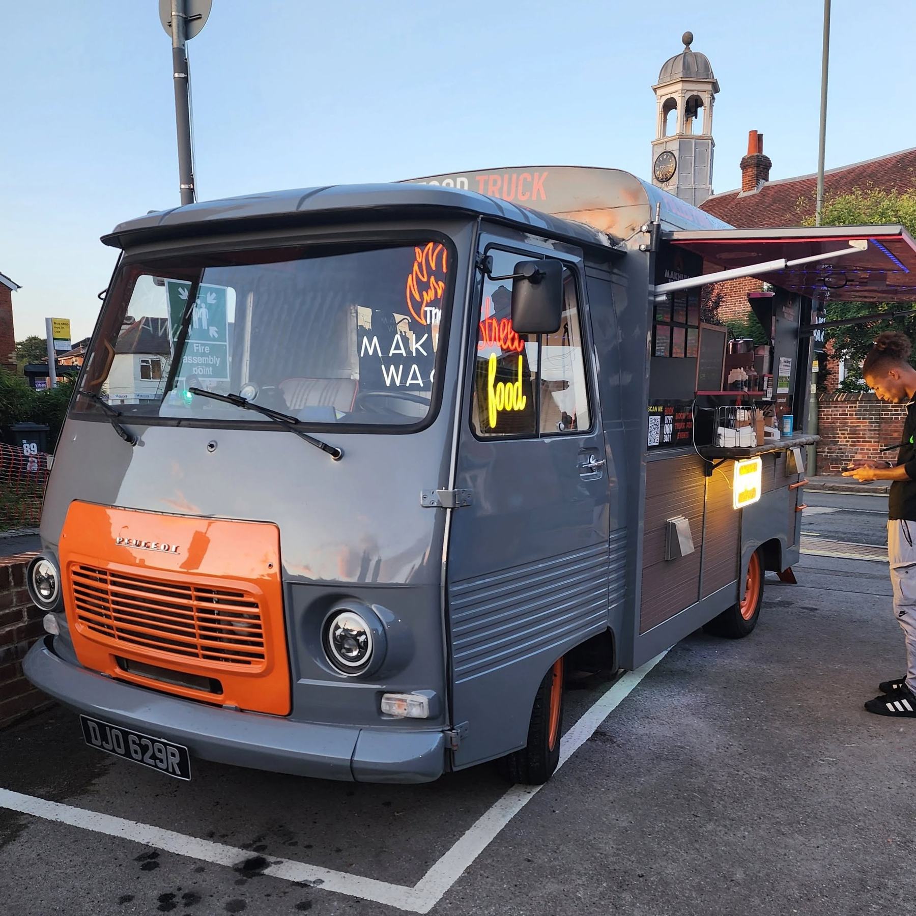 The grey and orange Makhulu Wagon parked up on a sunny afternoon