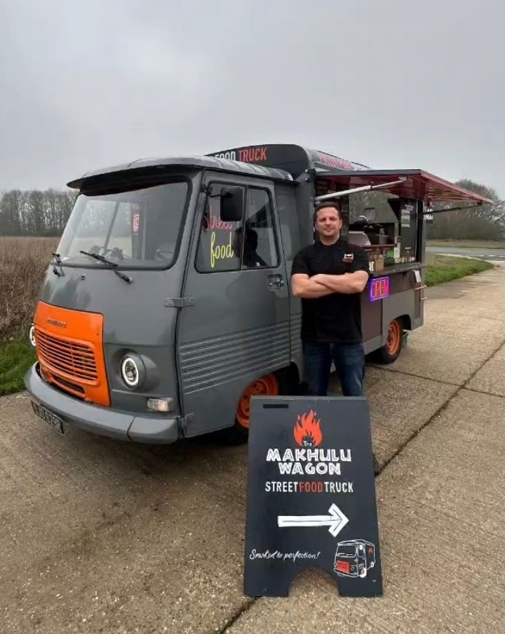Standing beside the Makhulu Wagon with its street food truck A-board