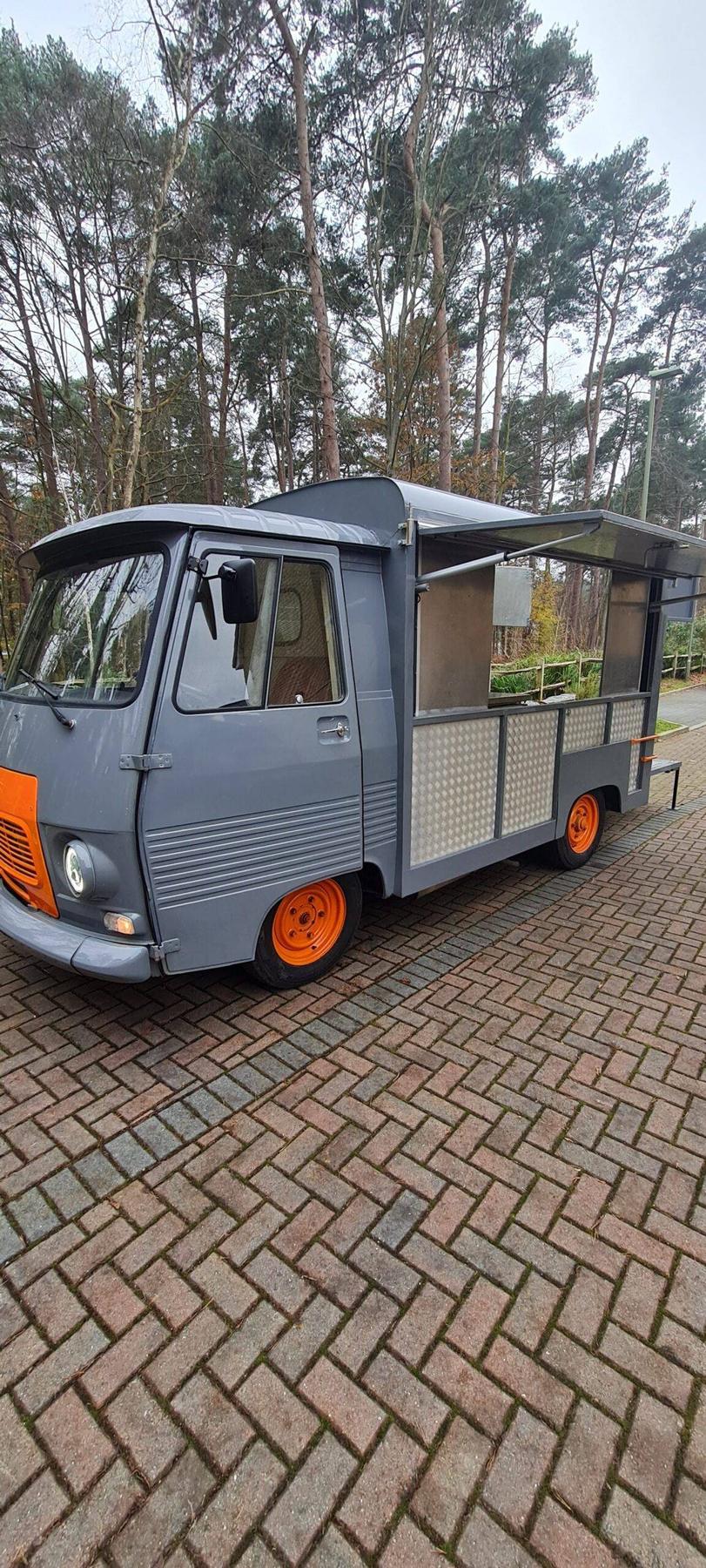 The Makhulu Wagon parked in front of autumn trees