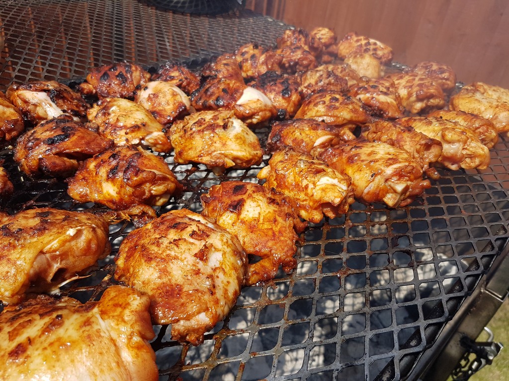 BBQ Chicken Thighs on the grill. barbeque braai food